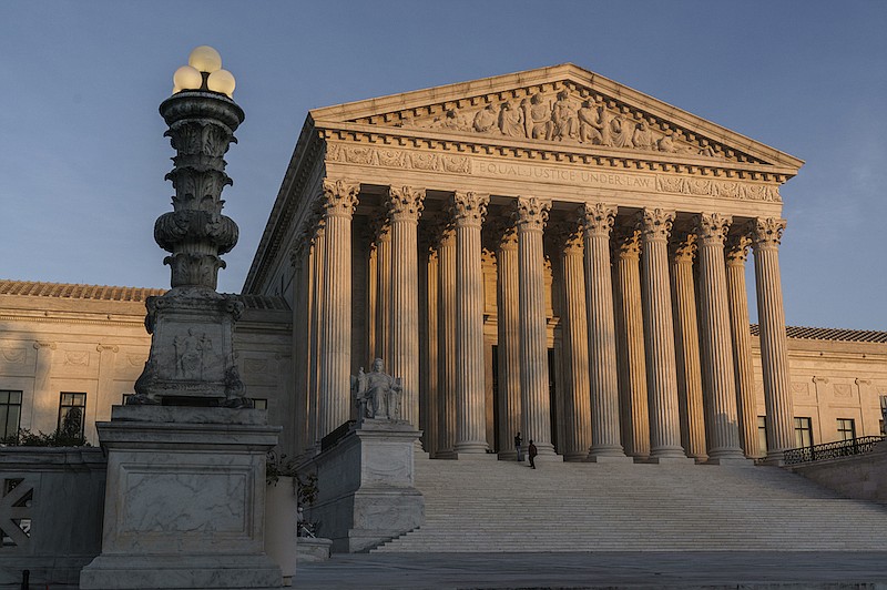 In this Nov. 6, 2020, file photo the Supreme Court is seen as sundown in Washington. The Supreme Court rejected on Dec. 11,a lawsuit backed by President Donald Trump to overturn Joe Biden's election victory, ending a desperate attempt to get legal issues rejected by state and federal judges before the nation's highest court. (AP Photo/J. Scott Applewhite, File)