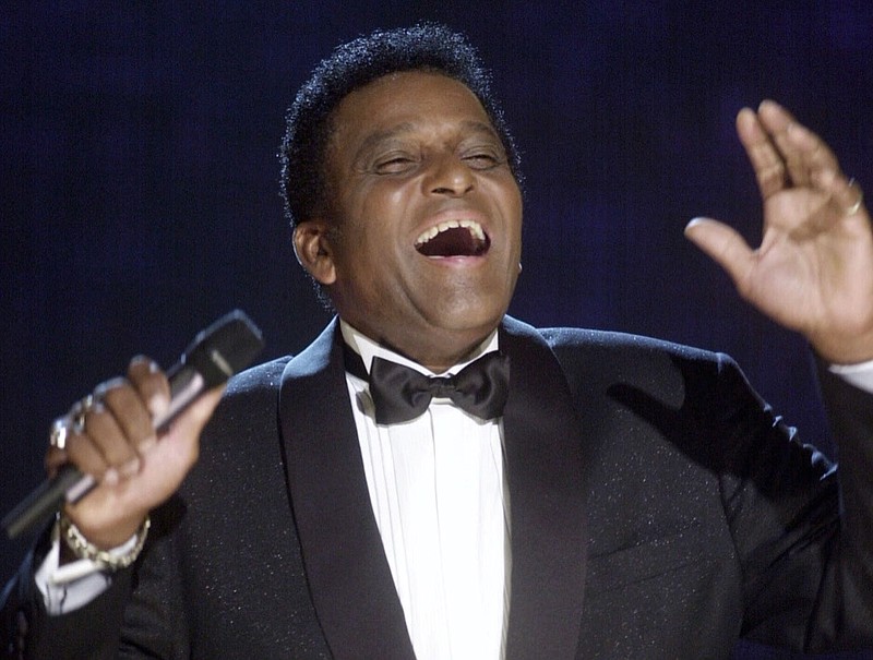 In this Oct. 4, 2000, file photo, Charley Pride performs during his induction into the Country Music Hall of Fame at the Country Music Association Awards show at the Grand Ole Opry House in Nashville, Tenn. Pride, the son of sharecroppers in Mississippi and became one of country music's biggest stars and the first Black member of the Country Music Hall of Fame, has died at age 86. Pride died Saturday, Dec. 12, 2020, in Dallas of complications from Covid-19, according to Jeremy Westby of the public relations firm 2911 Media. (AP Photo/Charlie Neibergall, File)
