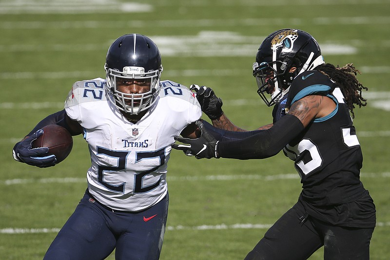 AP photo by Stephen B. Morton / Tennessee Titans running back Derrick Henry tries to fend off Jacksonville Jaguars cornerback Sidney Jones during the first half of Sunday's AFC South matchup in Jacksonville, Fla. Henry rushed for 215 yards and two touchdowns on 26 carries, and the Titans rolled to a 31-10 win.