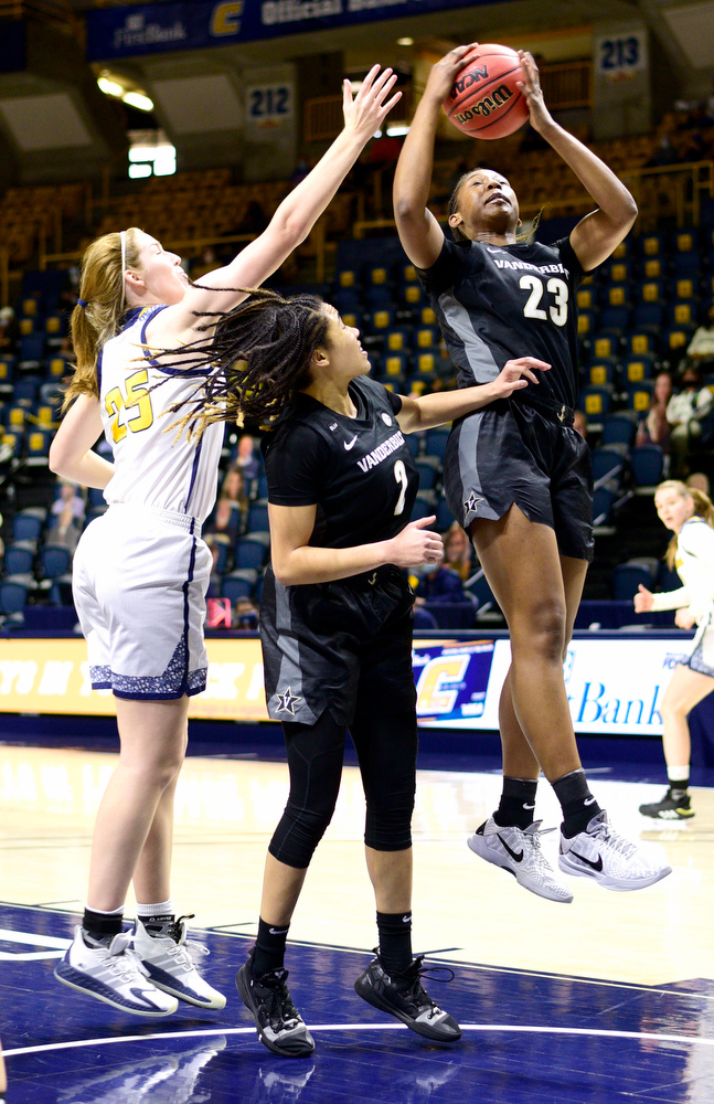 Staff Photo by Robin Rudd / Vanderbilt's Koi Love (23) pulls down a rebound against UTC's Abbey Cornelius (25). Looking on is Vanderbilt's Chelsie Hall (2). The University of Tennessee at Chattanooga lost a close home game to Vanderbilt, 80-78 in NCAA women's basketball at the McKenzie Arena on December 13, 2020. .