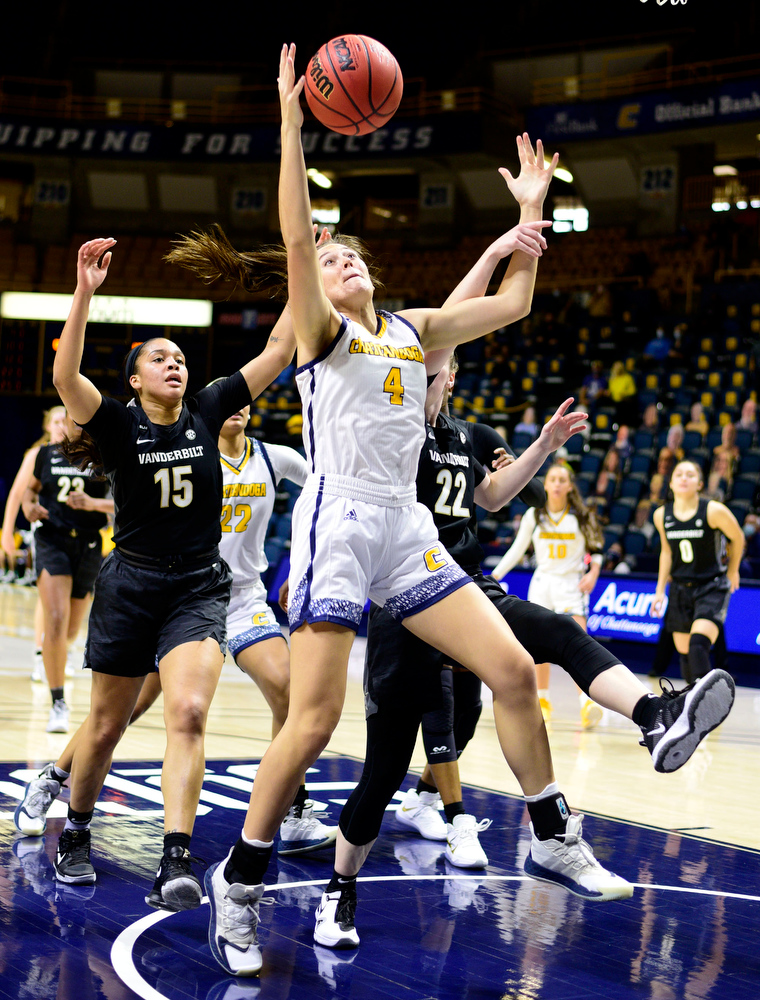 Staff Photo by Robin Rudd / UTC's Anna Walker (4) goes after a offensive rebound. The University of Tennessee at Chattanooga lost a close home game to Vanderbilt, 80-78 in NCAA women's basketball at the McKenzie Arena on December 13, 2020. .