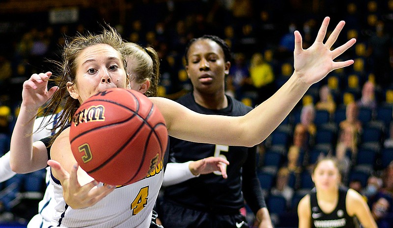 Staff photo by Robin Rudd / UTC freshman Anna Walker, a former Bradley Central standout, goes after an offensive rebound during Sunday's game against Vanderbilt at McKenzie Arena. The Mocs led for much of the game but lost 80-78 to fall to 1-3.