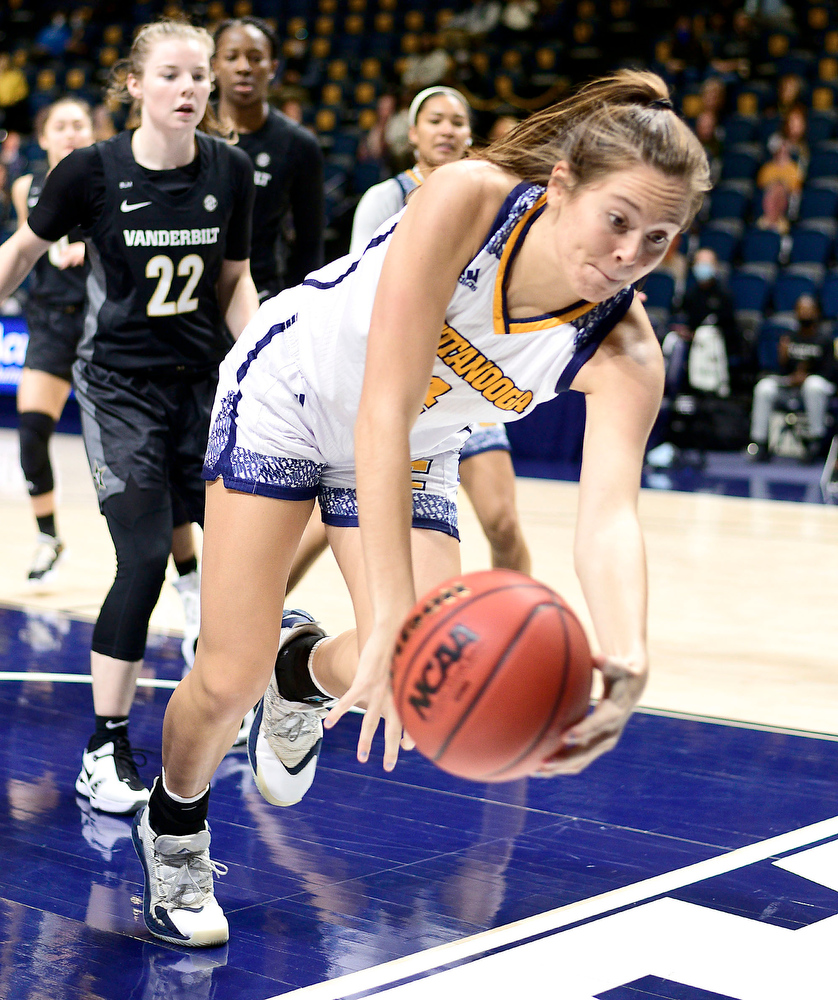 Staff Photo by Robin Rudd / UTC's Anna Walker (4) tries to save the ball from going out-of-bounds. The University of Tennessee at Chattanooga lost a close home game to Vanderbilt, 80-78 in NCAA women's basketball at the McKenzie Arena on December 13, 2020. .