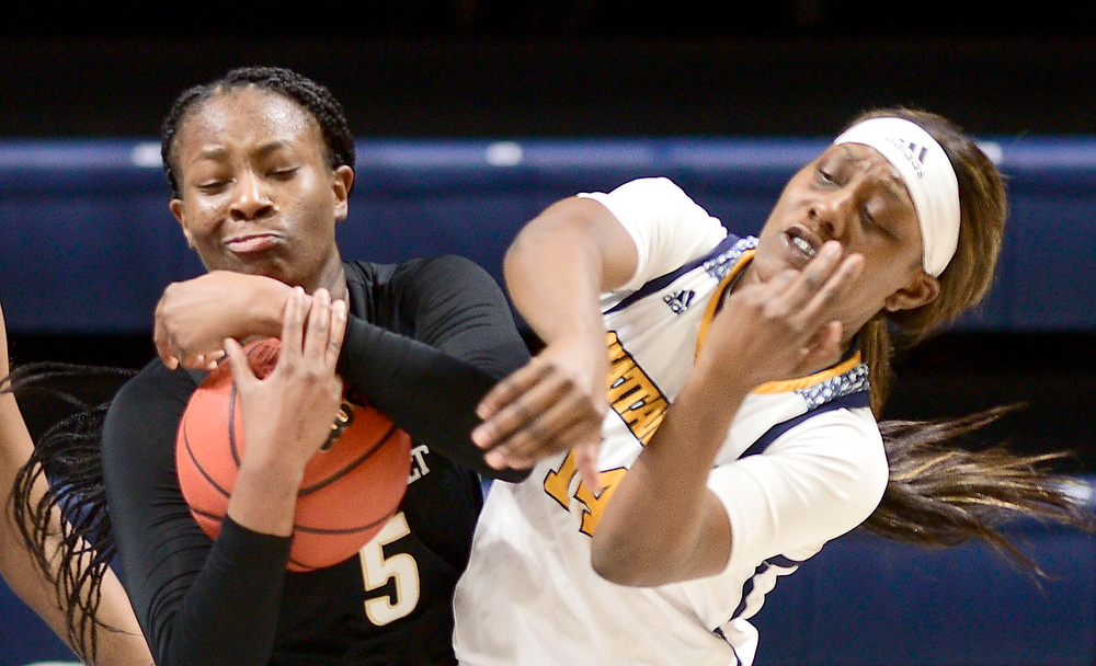 Staff Photo by Robin Rudd / Vanderbilt's Yaubryon Chambers (5) and UTC's Amaria Pugh (14) battle for a rebound. The University of Tennessee at Chattanooga lost a close home game to Vanderbilt, 80-78 in NCAA women's basketball at the McKenzie Arena on December 13, 2020. .