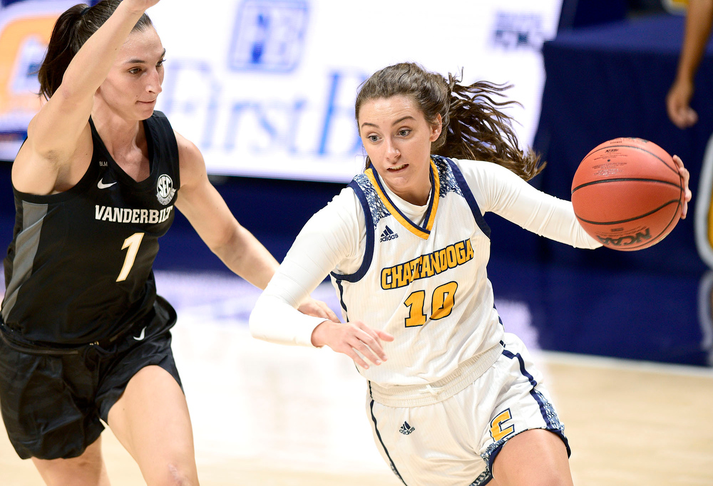 Staff Photo by Robin Rudd / UTC's Dena Jarrells drives against Vanderbilt's Enna Pehadzic (1). The University of Tennessee at Chattanooga lost a close home game to Vanderbilt, 80-78 in NCAA women's basketball at the McKenzie Arena on December 13, 2020. .