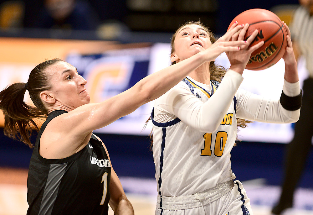 Staff Photo by Robin Rudd / UTC's Dena Jarrells drives to the basket and is foulded by Vanderbilt's Enna Pehadzic (1). The University of Tennessee at Chattanooga lost a close home game to Vanderbilt, 80-78 in NCAA women's basketball at the McKenzie Arena on December 13, 2020. .