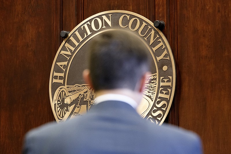 Staff photo by C.B. Schmelter / The Hamilton County seal is seen on the wall behind an applicant last year for General Sessions Judge before members of the Hamilton County Commission in the commission assembly room at the Hamilton County Courthouse.