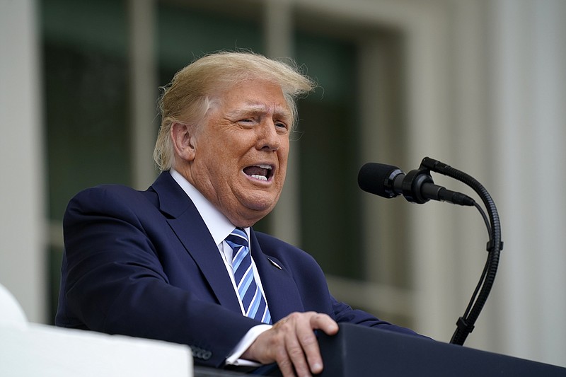 Associated Press File Photo / President Donald Trump speaks from the Blue Room Balcony of the White House to a crowd of supporters in Washington in October.