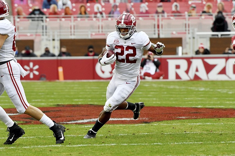 Alabama running back Najee Harris runs the ball against Arkansas during an NCAA college football game Saturday, Dec. 12, 2020, in Fayetteville, Ark. (AP Photo/Michael Woods)