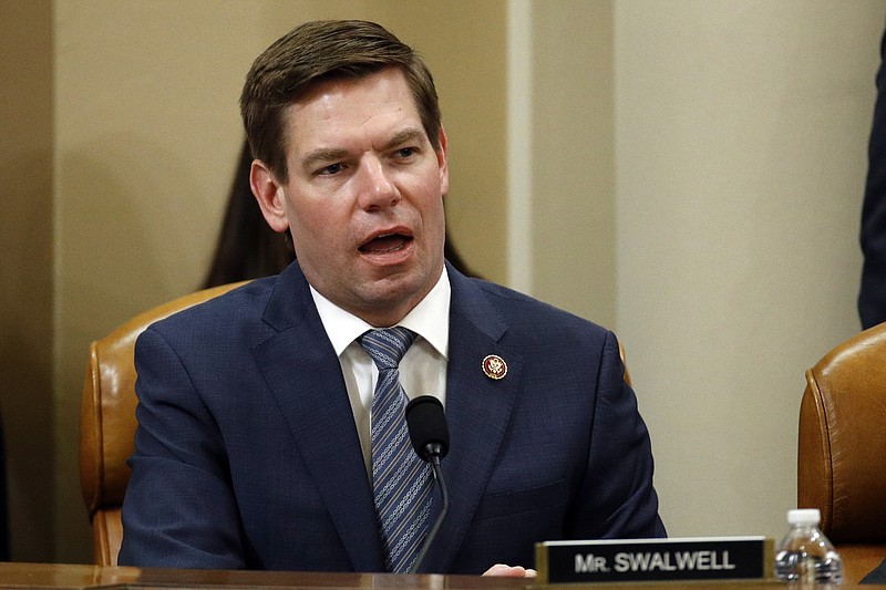 Photo by Patrick Semansky, Pool, The Associated Press / Rep. Eric Swalwell, D-California, votes to approve the second article of impeachment against President Donald Trump during a House Judiciary Committee meeting on Friday, Dec. 13, 2019, on Capitol Hill in Washington.