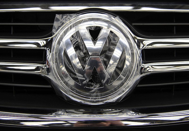 FILE - In this Nov. 14 2008, file photo a logo of German car maker Volkswagen is pictured on a car's grill, at a production line of the "Golf VI" at the Volkswagen headquarter in Wolfsburg, Germany. Automaker Volkswagen AG says on Thursday, July 29, 2010 its first-half net earnings surged to euro 1.82 billion (US dollar 2.4 billion) as strong demand from China and elsewhere pushed sales higher. Volkswagen's profit for the January-June period was up from euro 494 million a year earlier. (AP Photo/Fabian Bimmer, File)