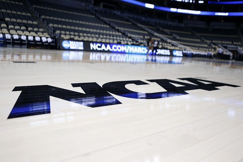 FILE - The NCAA logo is on the court at The Consol Energy Center in Pittsburgh. 