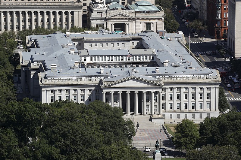 The U.S. Treasury Department building viewed from the Washington Monument, Wednesday, Sept. 18, 2019, in Washington. Hackers got into computers at the U.S. Treasury Department and possibly other federal agencies, touching off a government response involving the National Security Council. Security Council spokesperson John Ullyot said Sunday, Dec. 13, 2020 that the government is aware of reports about the hacks. (AP Photo/Patrick Semansky, file)