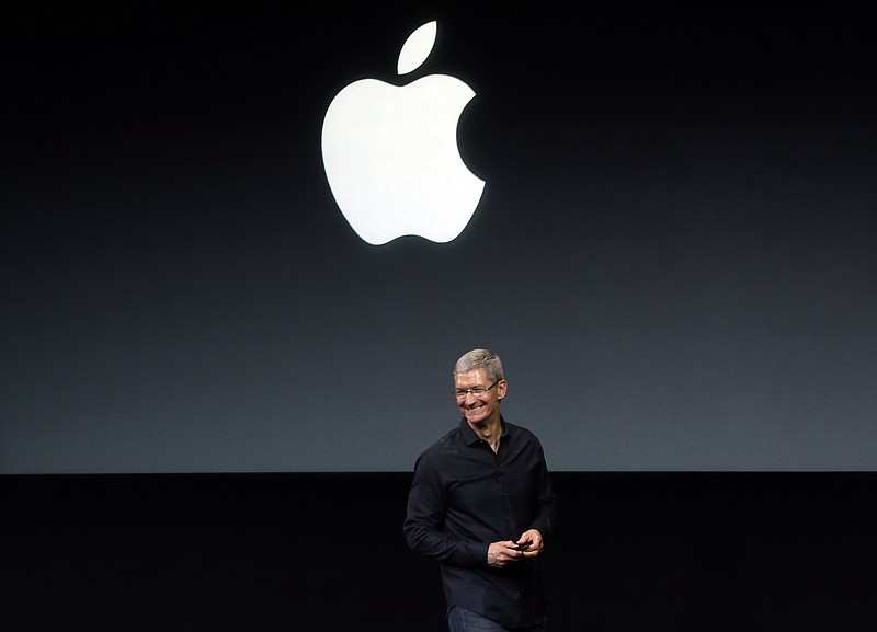 FILE - In this Tuesday, Sept. 10, 2013, file photo, Apple CEO Tim Cook speaks on stage before a new product introduction in Cupertino, Calif. (AP Photo/Marcio Jose Sanchez, File)