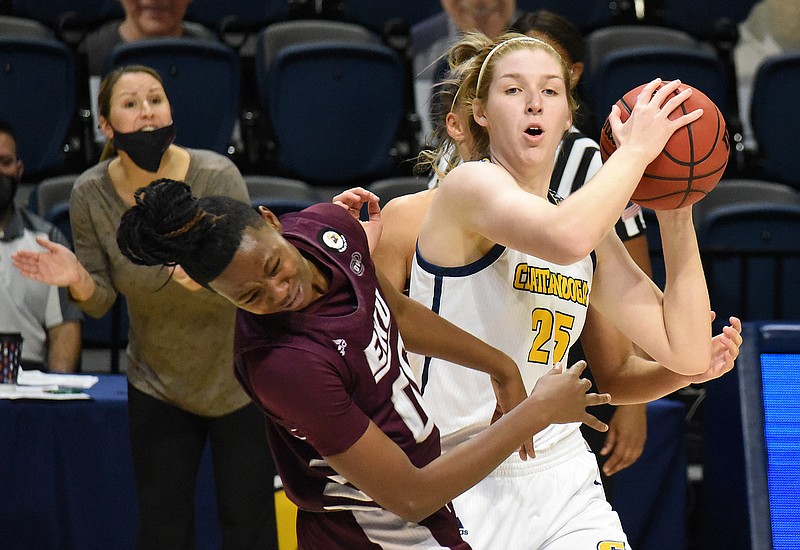 Staff Photo by Matt Hamilton / UTC (25) Abbey Cornelius is called for the foul as EKU (00) Jayla Johnson reacts at McKenzie Arena on Friday, Dec. 18, 2020. Eastern Kentucky University went on to defeat the Lady Mocs. 