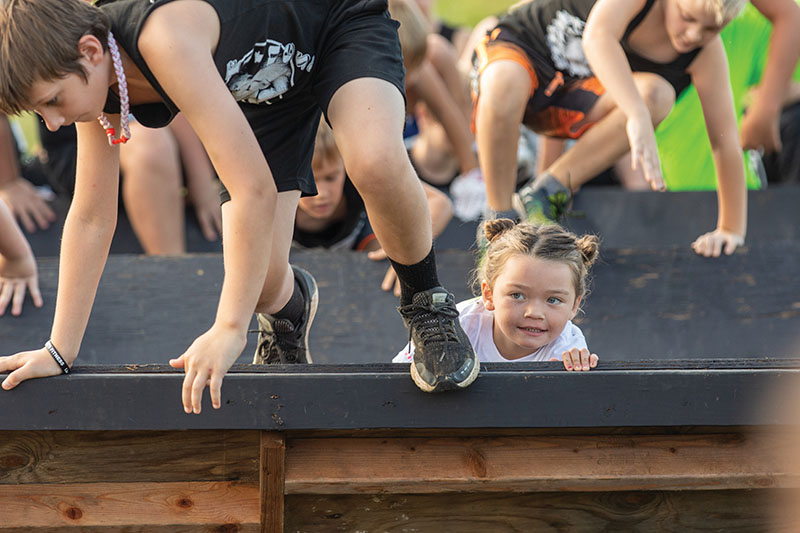 Sadie-Beth Craton competes in the kids race during the CHI Memorial Scenic City Mud Run. / Photo by Dan Henry/ DanHenryPhotography.com