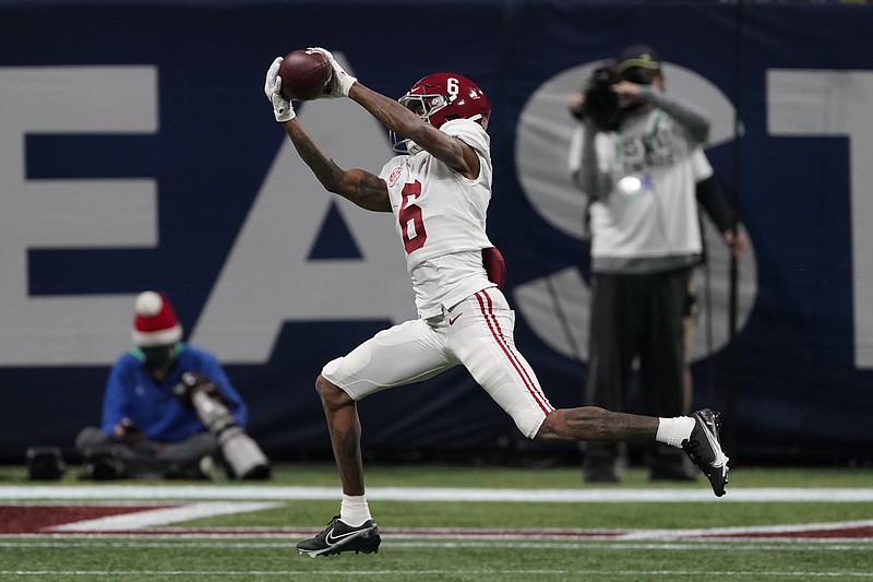 Alabama wide receiver DeVonta Smith (6) makes a catch for a touchdown against Florida during the first half of the Southeastern Conference championship NCAA college football game, Saturday, Dec. 19, 2020, in Atlanta. (