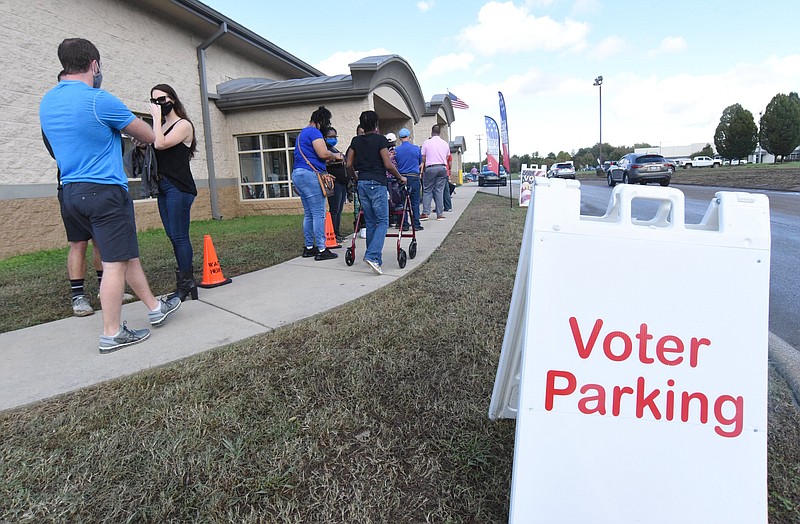 Staff Photo by Matt Hamilton / Voters wait in line at the Hamilton County Election Commission on Thursday, Oct. 29, 2020.