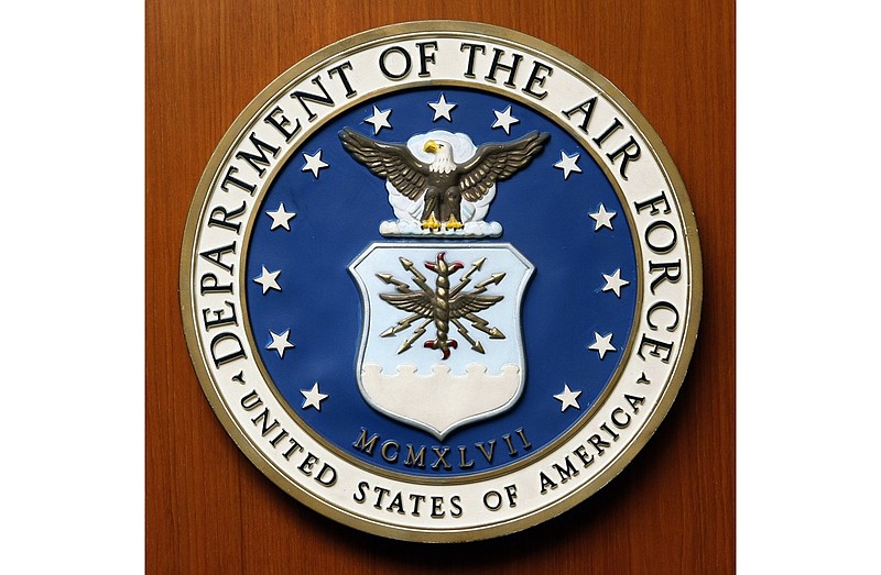 FILE - This Friday, Aug. 10, 2007, file photo, shows the logo of the Department of the U.S. Air Force at the United Staes embassy, in Berlin. A new report issued Monday, Dec. 21, 2020, on racial disparities in the Air Force concludes that Black service members in the service are far more likely to be investigated, arrested, face disciplinary actions, and be discharged for misconduct. (AP Photo/Michael Sohn, File)