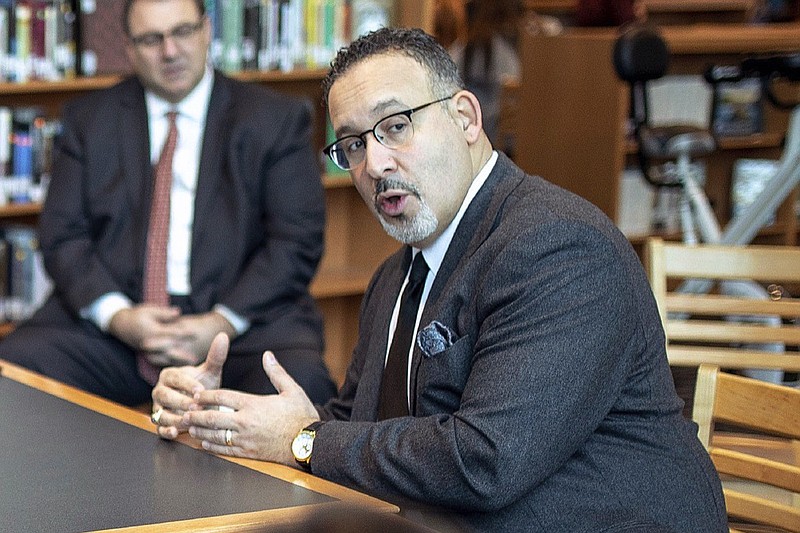 FILE - In this Jan. 28, 2020 file photo, Connecticut State Commissioner of Education Miguel Cardona speaks with Berlin High School students while on a tour of the school. President-elect Joe Biden has chosen the education commissioner for Connecticut and a former public school teacher to serve as education secretary. (Devin Leith-Yessian/Berlin Citizen/Record-Journal via AP)