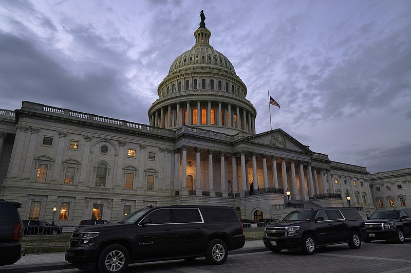 Dusk falls over the Capitol, Monday, Dec. 21, 2020, in Washington. Congressional leaders have hashed out a massive, year-end catchall bill that combines $900 billion in COVID-19 aid with a $1.4 trillion spending bill and reams of other unfinished legislation on taxes, energy, education and health care. (AP Photo/Jacquelyn Martin)