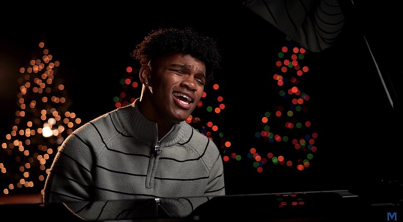 McCallie School photo / McCallie football standout Aaron Crowder, a junior linebacker, plays the piano and sings "Happy Xmas (War is Over)" in a music video released by the school this month.