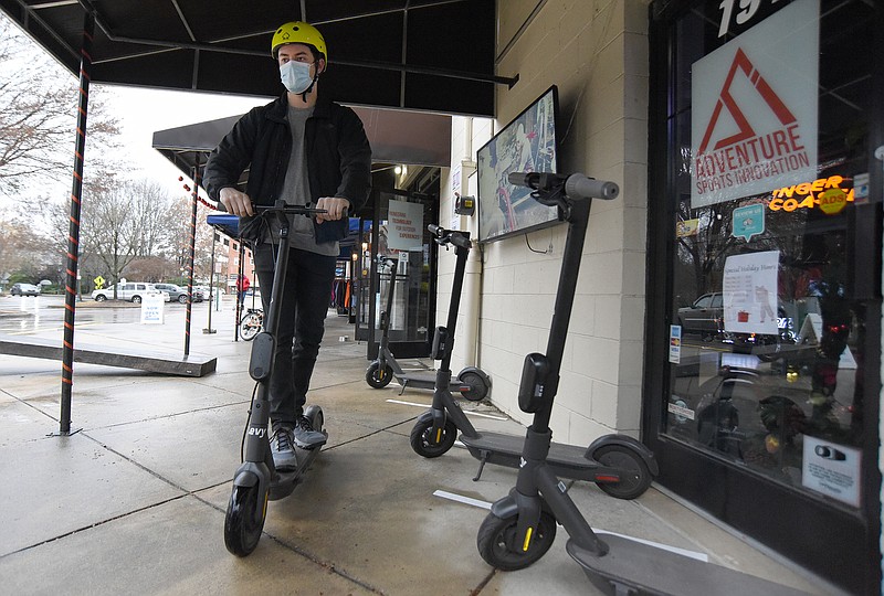 Staff Photo by Matt Hamilton / Clark Dunn rides an e-scooter at Adventure Sport Innovation near Coolidge Park on Chattanooga's North Shore.