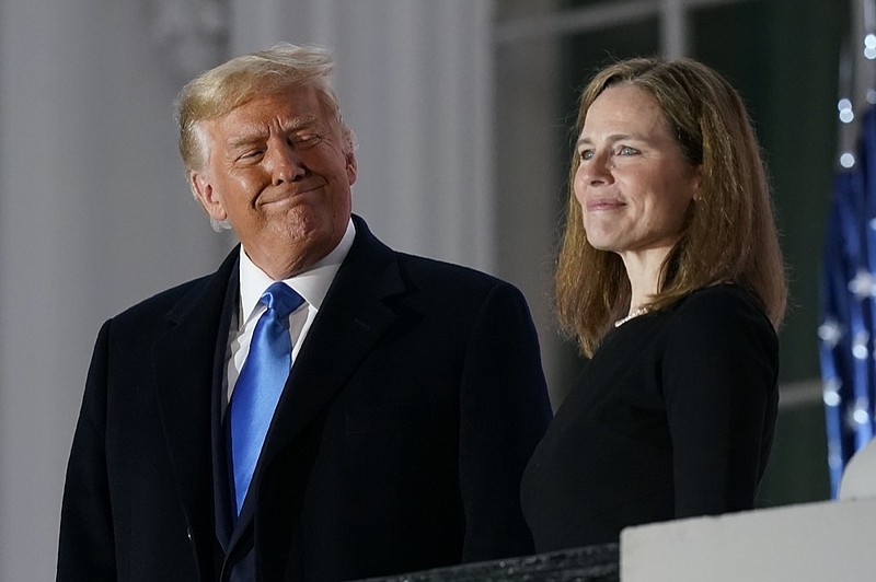 FILE - In this Monday, Oct. 26, 2020 file photo, President Donald Trump and Amy Coney Barrett stand on the Blue Room Balcony after Supreme Court Justice Clarence Thomas administered the Constitutional Oath to her on the South Lawn of the White House White House in Washington. (AP Photo/Patrick Semansky, File)


