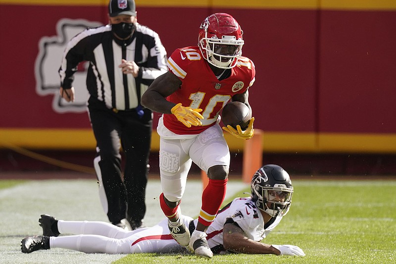 AP photo by Charlie Riedel / Kansas City Chiefs wide receiver Tyreek Hill runs down the sideline after evading a tackle attempt by Atlanta Falcons cornerback A.J. Terrell on Sunday.