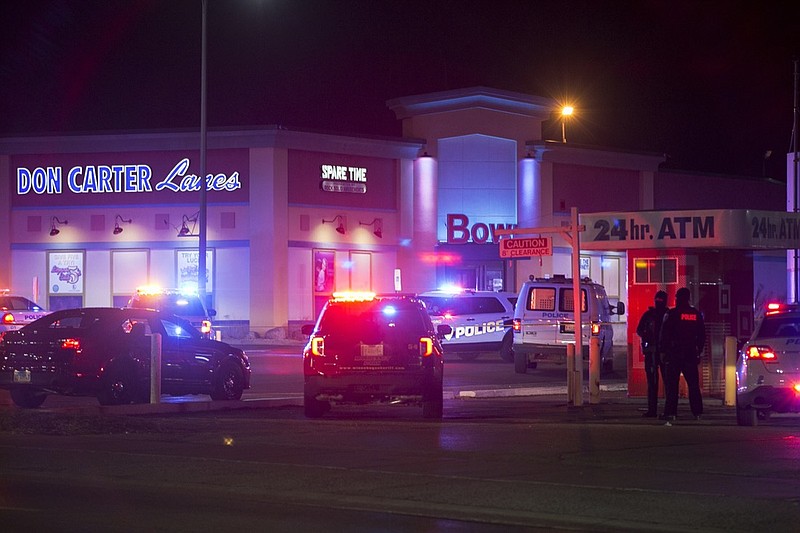 Rockford police and other law enforcement agencies investigate the scene of a shooting at bowling alley Don Carter Lanes on Saturday, Dec. 26, 2020, in Rockford, Ill. (Scott P. Yates/Rockford Register Star via AP)