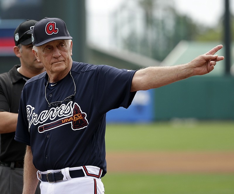 FILE - In this March 13, 2017, file photo, former MLB pitcher and Baseball Hall of Famer Phil Niekro waves to fans after he was introduced before a spring training baseball game between the Atlanta Braves and the Pittsburgh Pirates in Kissimmee, Fla. Niekro, who pitched well into his 40s with a knuckleball that baffled big league hitters for more than two decades, mostly with the Braves, has died after a long fight with cancer, the team announced Sunday, Dec. 27, 2020. He was 81. (AP Photo/John Raoux, File)