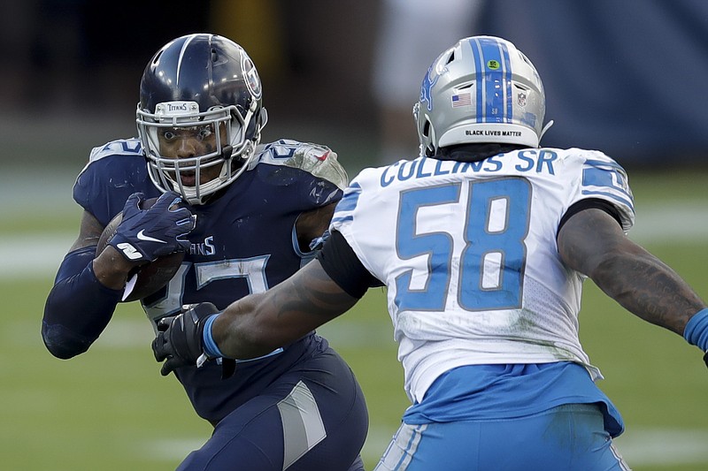 FILE - In this Dec. 20, 2020, file photo, Tennessee Titans running back Derrick Henry , left, runs past Detroit Lions outside linebacker Jamie Collins during the second half of an NFL football game in Nashville, Tenn. Henry led the NFL with 1,540 yards rushing last season before running the Titans to their first AFC championship game in 17 years. (AP Photo/Ben Margot, File)