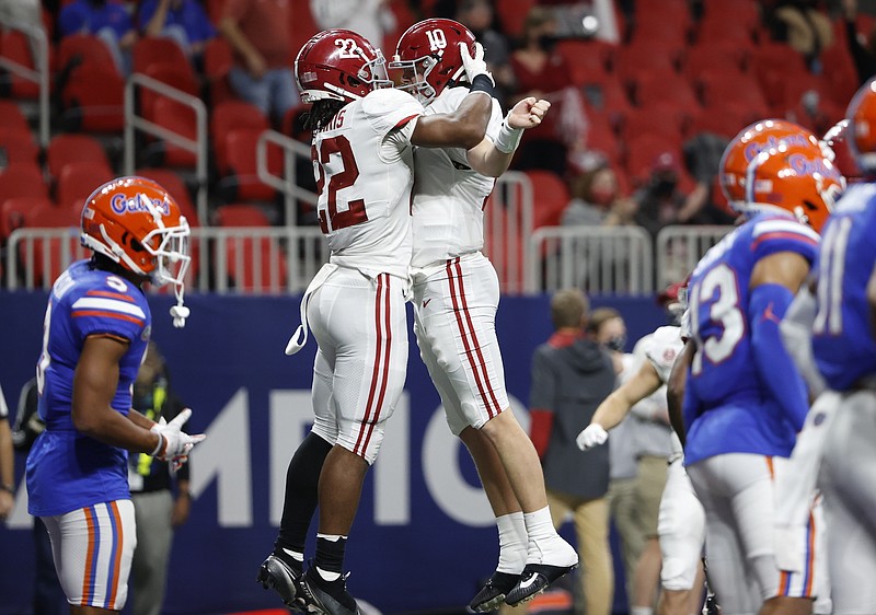 Crimson Tide photos / Running back Najee Harris and quarterback Mac Jones, members of Alabama's 2017 signing class, celebrate a touchdown during the Crimson Tide's win over Florida at the SEC championship game earlier this month.