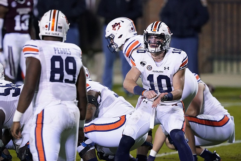 AP photo by Rogelio V. Solis / Auburn quarterback Bo Nix (10) calls out to tight end J.J. Pegues as the Tigers line up on offense during the regular-season finale at Mississippi State on Dec. 12. It wound up being the final game of Gus Malzahn's eight-year tenure as Auburn's coach.