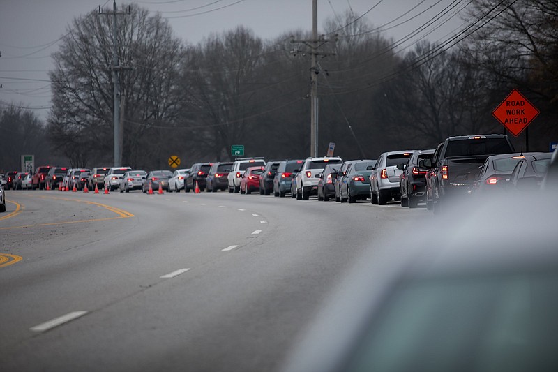 Staff photo by Troy Stolt / Hamilton County residents wait in line on Amnicola Parkway to get the Pfizer coronavirus vaccine at the Tennessee Riverpark on Thursday, Dec. 31, 2020, in Chattanooga, Tenn. Thursday was the first day Hamilton County allowed for residents 75 and older to get vaccinated, which resulted in long wait times.