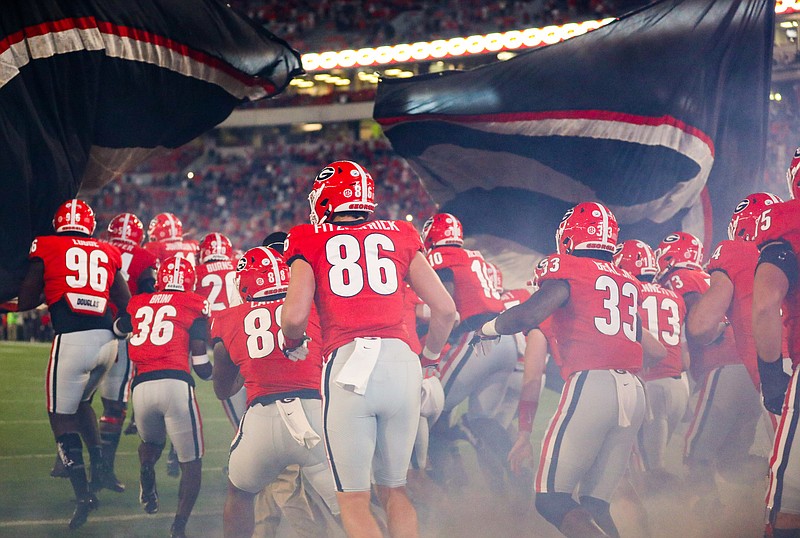 Georgia photo by Chamberlain Smith / Georgia football players take the field before the Oct. 3 game against Auburn inside Sanford Stadium, which Bulldogs coach Kirby Smart said was the best atmosphere his team has experienced this season.