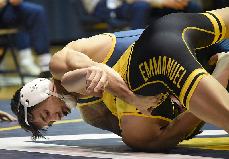 Staff photo by Matt Hamilton / UTC's Fabian Gutierrez turns Emmanuel College's Anthony Cruz in the 125-pound bout Saturday at Maclellan Gym. Gutierrez, who is ranked No. 19 nationally, opened the dual meet with a 16-0 technical fall.