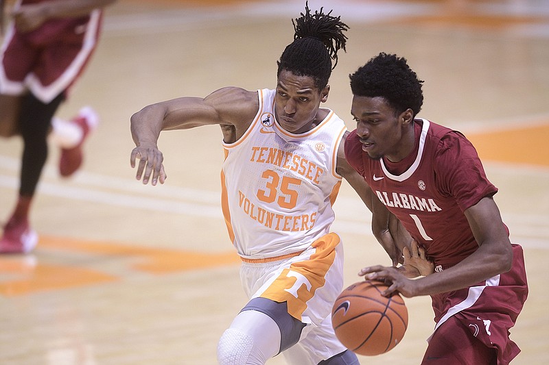 AP photo by Caitie McMekin / Tennessee's Yves Pons (35) guards Alabama's Herbert Jones before fouling him during Saturday's SEC matchup at Thompson-Boling Arena in Knoxville. Alabama won 71-63 as the Vols lost for the first time in eight games to start the season.