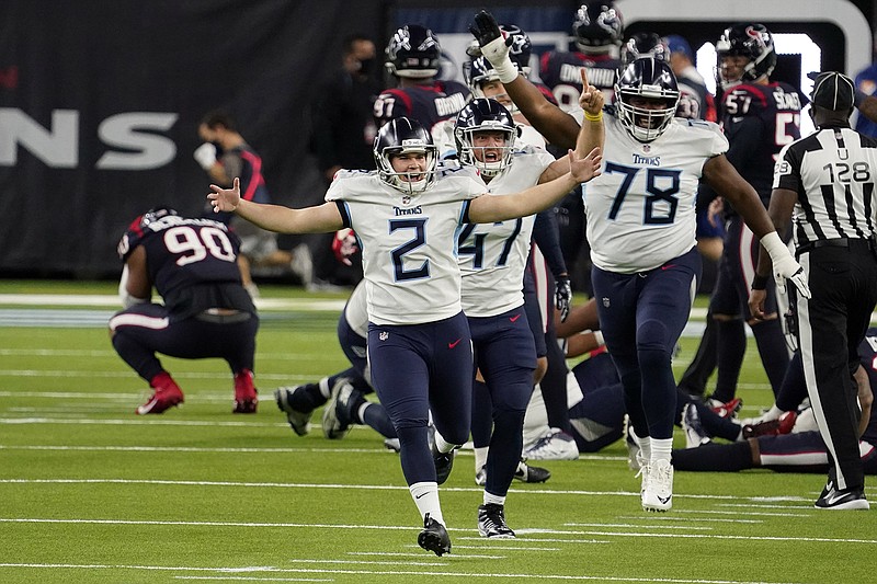 AP photo by Sam Craft / Tennessee Titans kicker Sam Sloman (2) celebrates after making the winning 37-yard field goal against the Houston Texans at the end of Sunday's game in Houston. The Titans' 38-35 victory locked up their first AFC South Division title since the 2008 season.