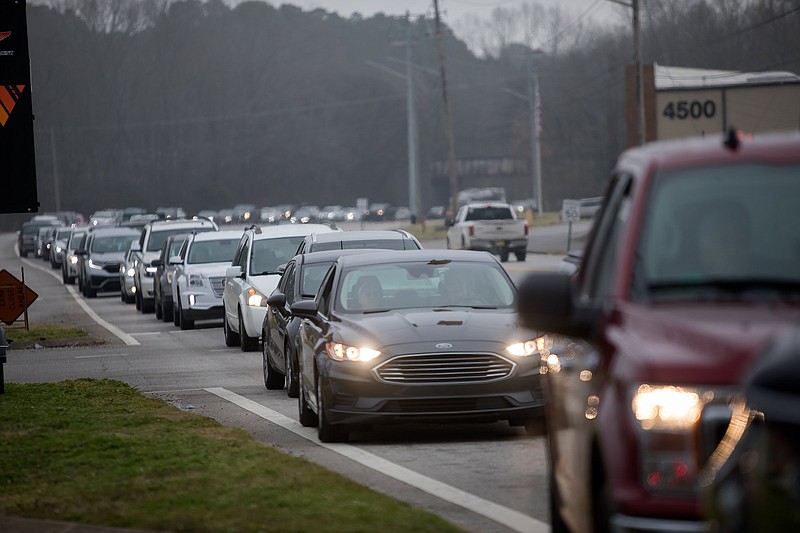 Staff photo by Troy Stolt / Hamilton County residents wait in line on Amnicola Parkway to get the Pfizer coronavirus vaccine at the Tennessee Riverpark on Thursday, Dec. 31, 2020, in Chattanooga, Tenn.