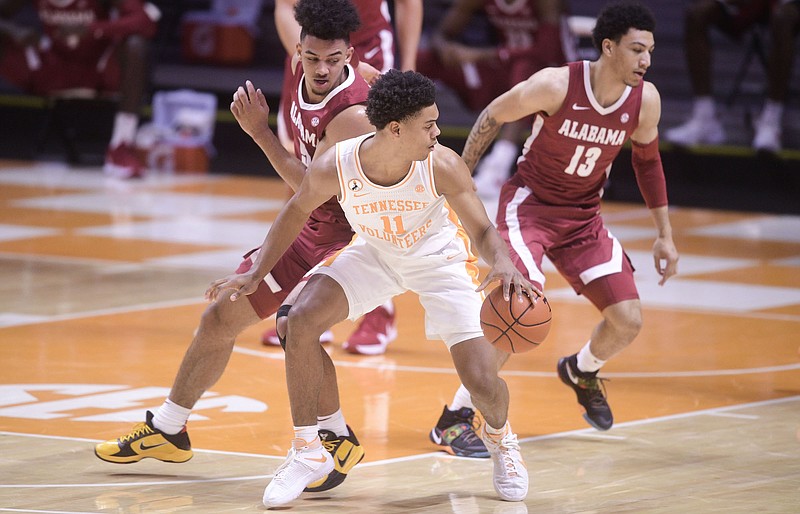 Tennessee Athletics photo / Tennessee freshman guard Jaden Springer dribbles as Alabama's Jaden Shackelford defends during Saturday night's 71-63 win by the Crimson Tide. Springer rolled an ankle that prevented him from playing in the second half.