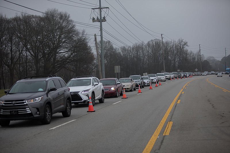 Staff photo by Troy Stolt / Hamilton County residents wait in line on Amnicola Parkway to get the Pfizer coronavirus vaccine at the Tennessee Riverpark on Thursday, Dec. 31, 2020, in Chattanooga.