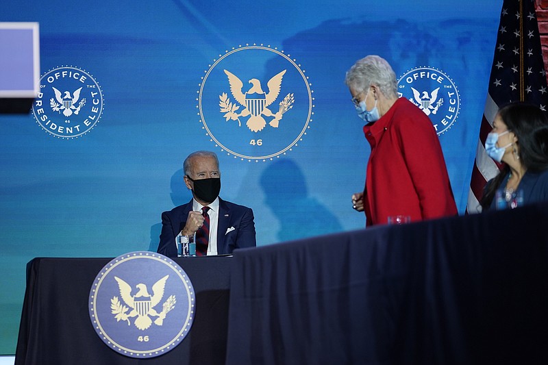 Photo by Carolyn Kaster of The Associated Press / President-elect Joe Biden watches as his appointee for National Climate Adviser, Gina McCarthy stands to speak at The Queen Theater in Wilmington, Delaware, on Saturday, Dec. 19, 2020.