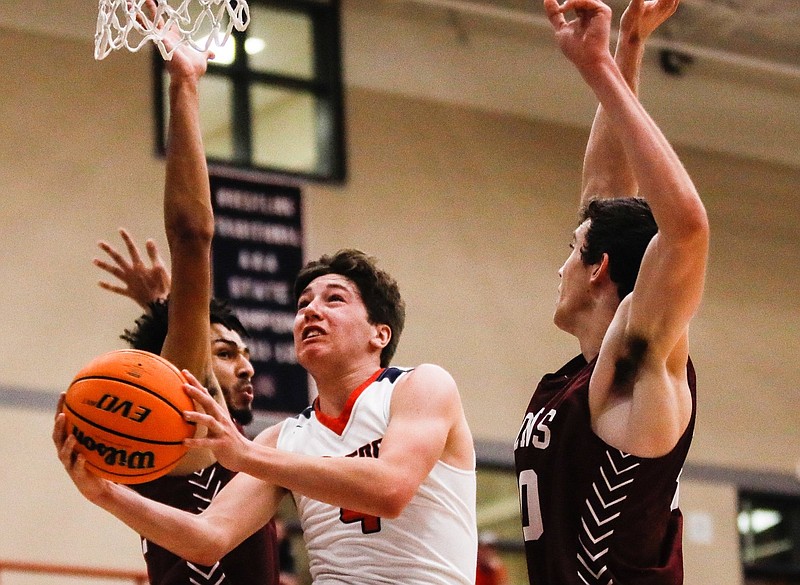 Staff photo by Troy Stolt / Heritage guard Cooper Terry (4) lays the ball up during the Generals' home basketball game against Central-Carrollton on Tuesday, Jan. 5, 2021 in Ringgold, Georgia. Heritage would win the game 54-53.