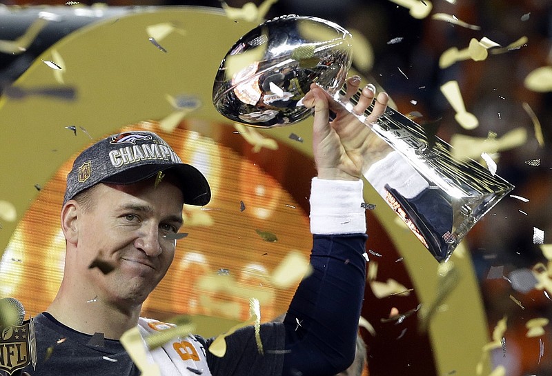FILE - In this Feb. 7, 2016, file photo, Denver Broncos quarterback Peyton Manning holds up the Vince Lombardi Trophy after the Broncos defeated the Carolina Panthers 24-10 in NFL football's Super Bowl 50 in Santa Clara, Calif. Manning, in his first-year of eligibility, was selected as a finalist for the Pro Football Hall of Fame's class of 2021 on Tuesday, Jan. 5, 2021. (AP Photo/Julie Jacobson, File)