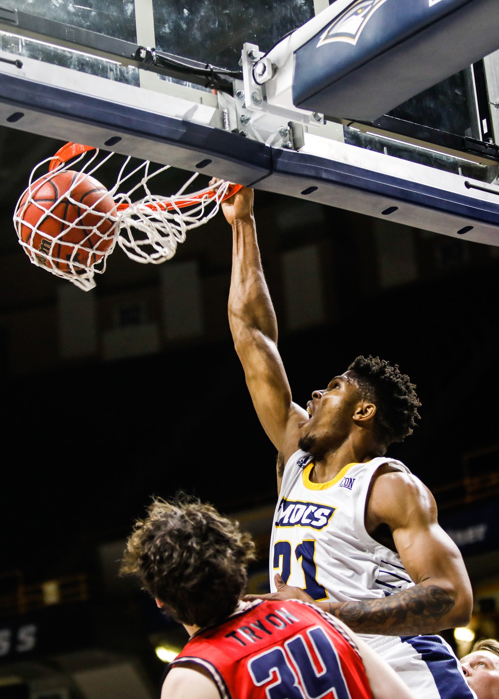 Staff photo by Troy Stolt / Chattanooga Mocs forward Josh Ayeni (21) dunks the ball during the UTC home basketball game against Samford at Mckenzie Arena on Wednesday, Jan. 6, 2021 in Chattanooga, Tenn.