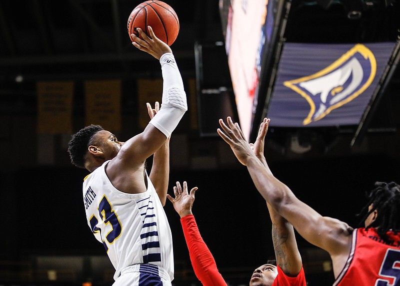 Staff photo by Troy Stolt / Chattanooga Mocs guard Malachi Smith (13) shoots the ball during the UTC home basketball game against Samford at Mckenzie Arena on Wednesday, Jan. 6, 2021 in Chattanooga, Tenn.
