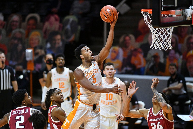 Tennessee's Josiah-Jordan James (5) attempts to score in the NCAA men's basketball game against Arkansas in Knoxville, Tenn. on Wednesday, January 6, 2021. (Saul Young/Pool via News Sentinel)