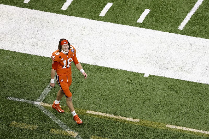 Clemson quarterback Trevor Lawrence leaves the field after their loss against Ohio State during the Sugar Bowl NCAA college football game Friday, Jan. 1, 2021, in New Orleans. Ohio State won 49-28. (AP Photo/Butch Dill)