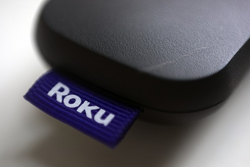 This Aug. 13, 2020 file photo shows a logo for Roku on a remote control in Portland, Ore. On Friday, Jan. 8, 2021, Roku is buying short-lived streaming service Quibi's content library to bolster content for its free Roku Channel. Financial terms were undisclosed. AP Photo/Jenny Kane, File)